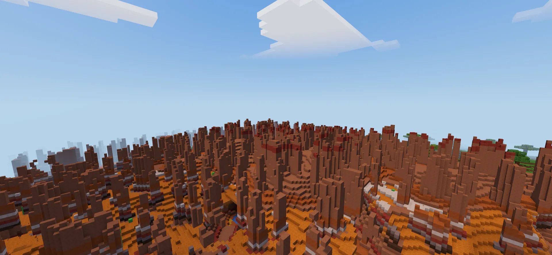 Hoodoo spires of banded red rock in a canyon