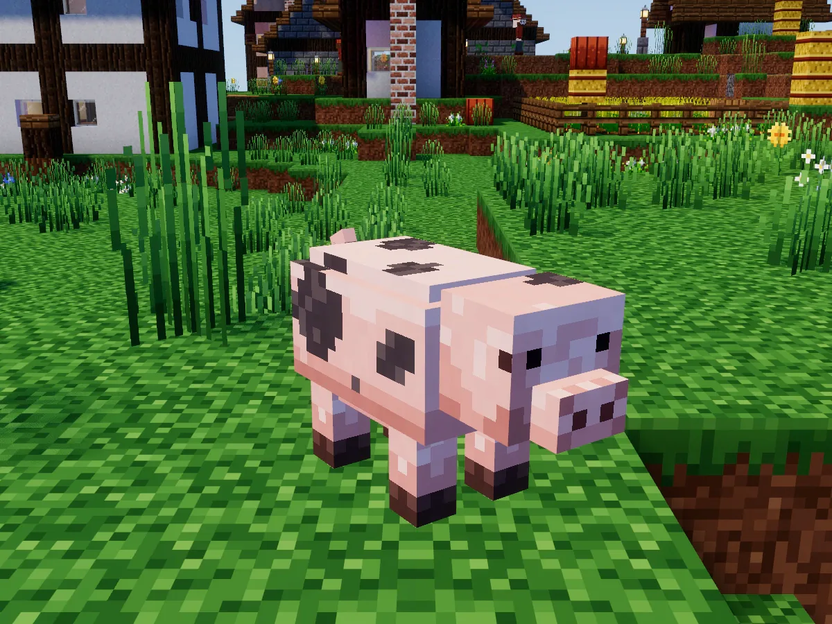 A pink pig with dark spots