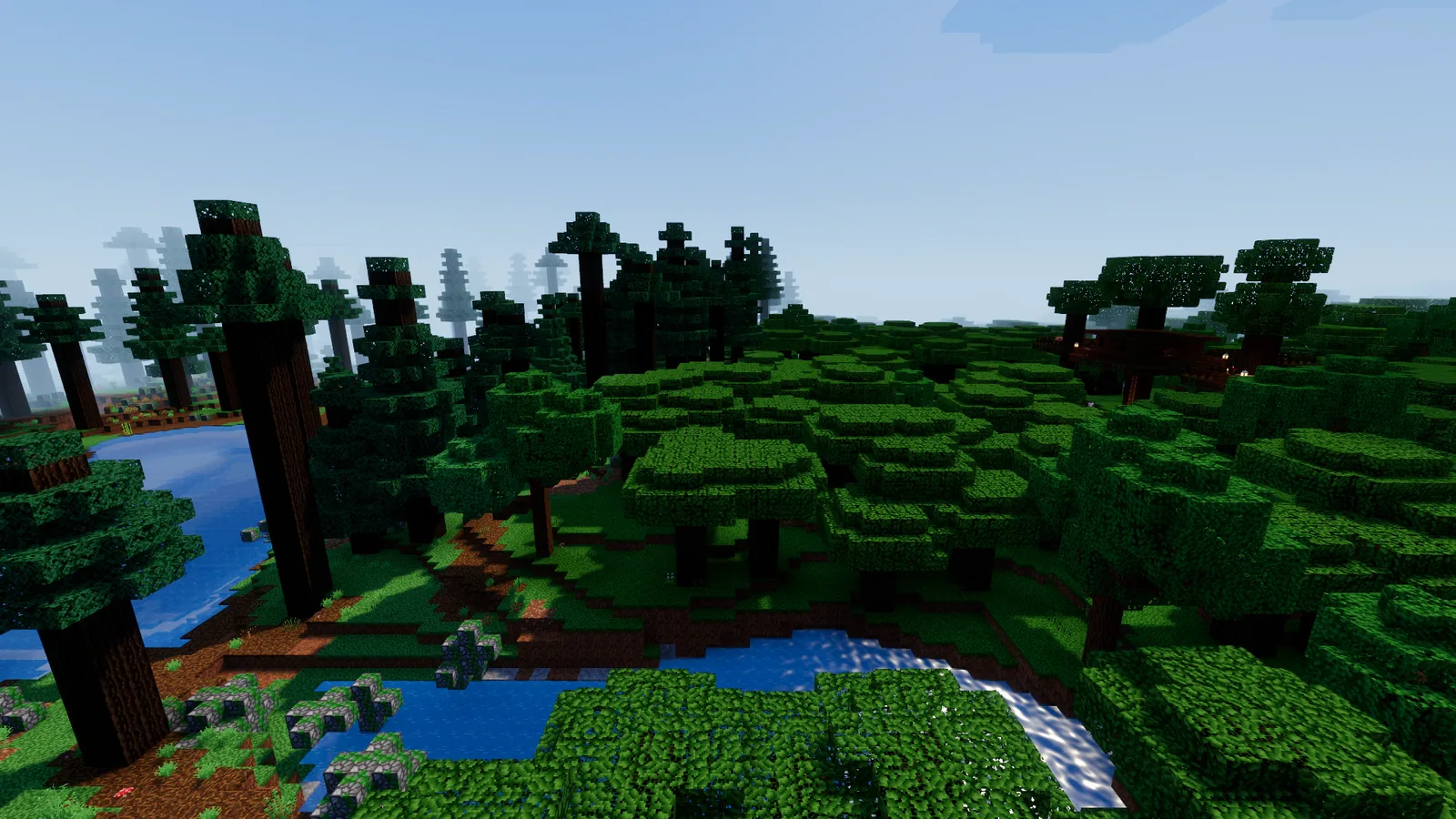 A dark forest of wide crowns along a river