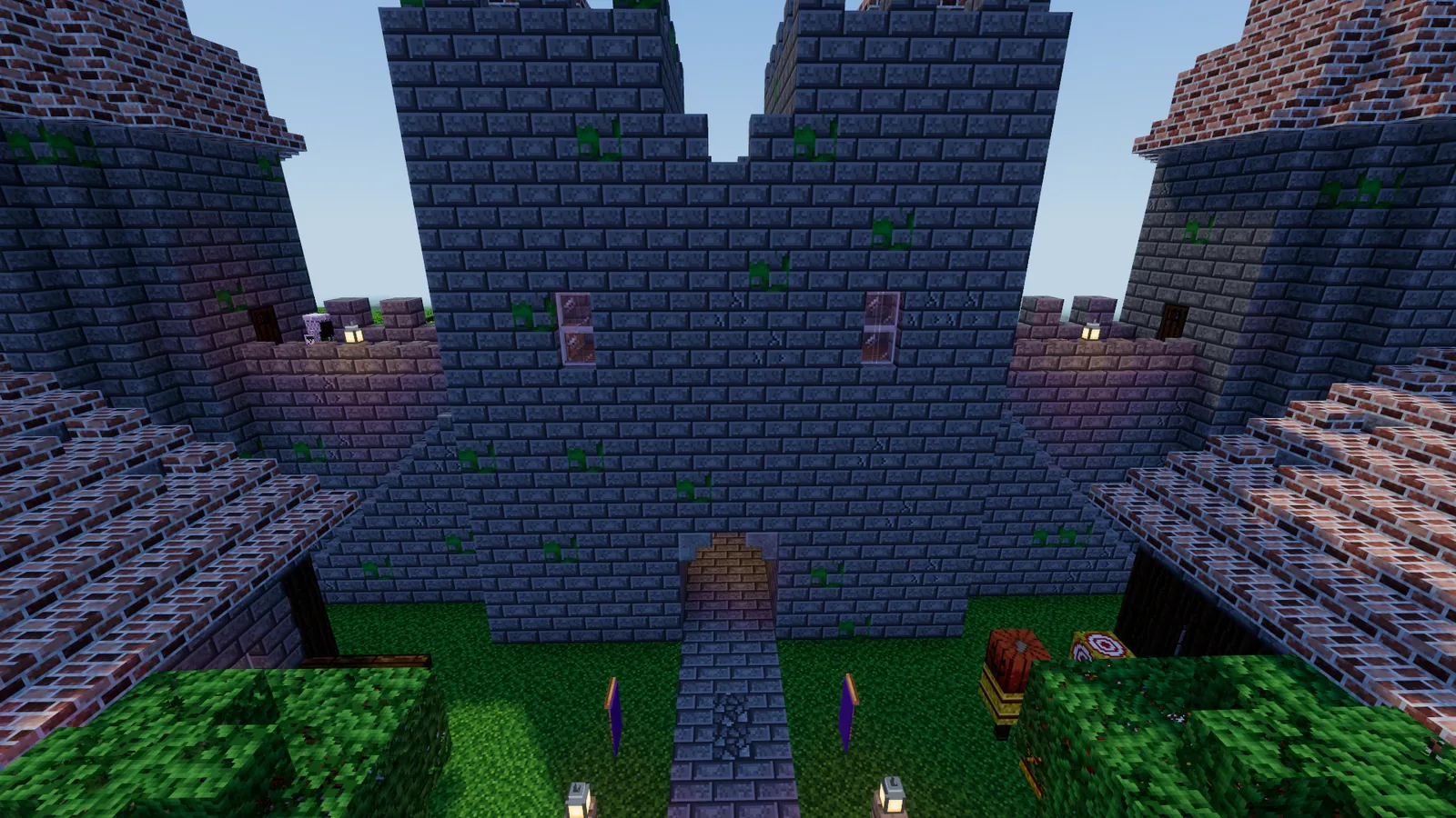 The courtyard of a castle with its gatehouse and walls