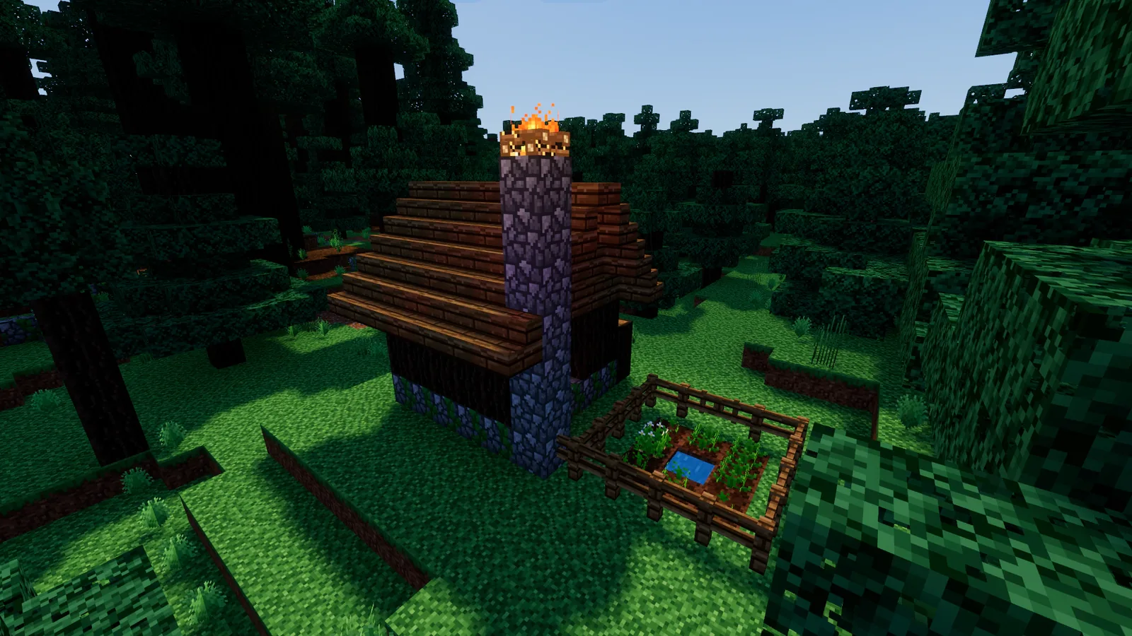 A log hut with a garden in the woods