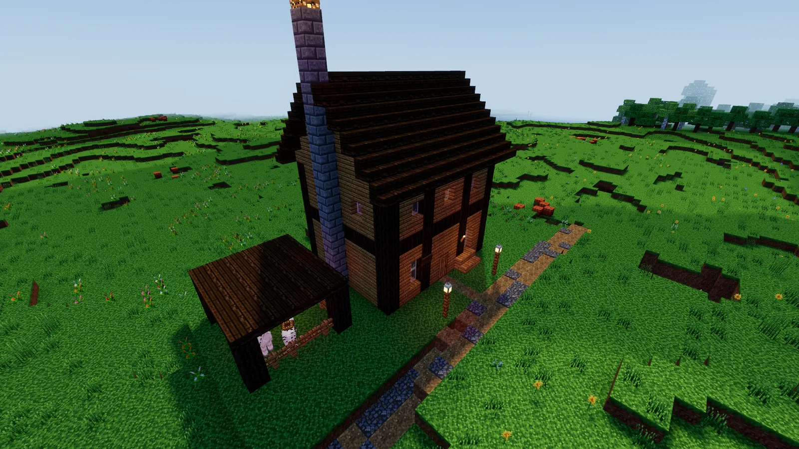 A timbered roadside inn with a stable