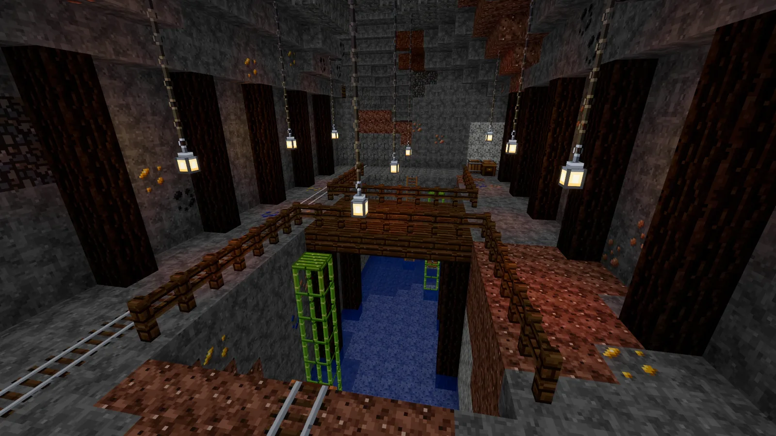 A great underground hall over a chasm, lanterns hanging on chains and a bridge across